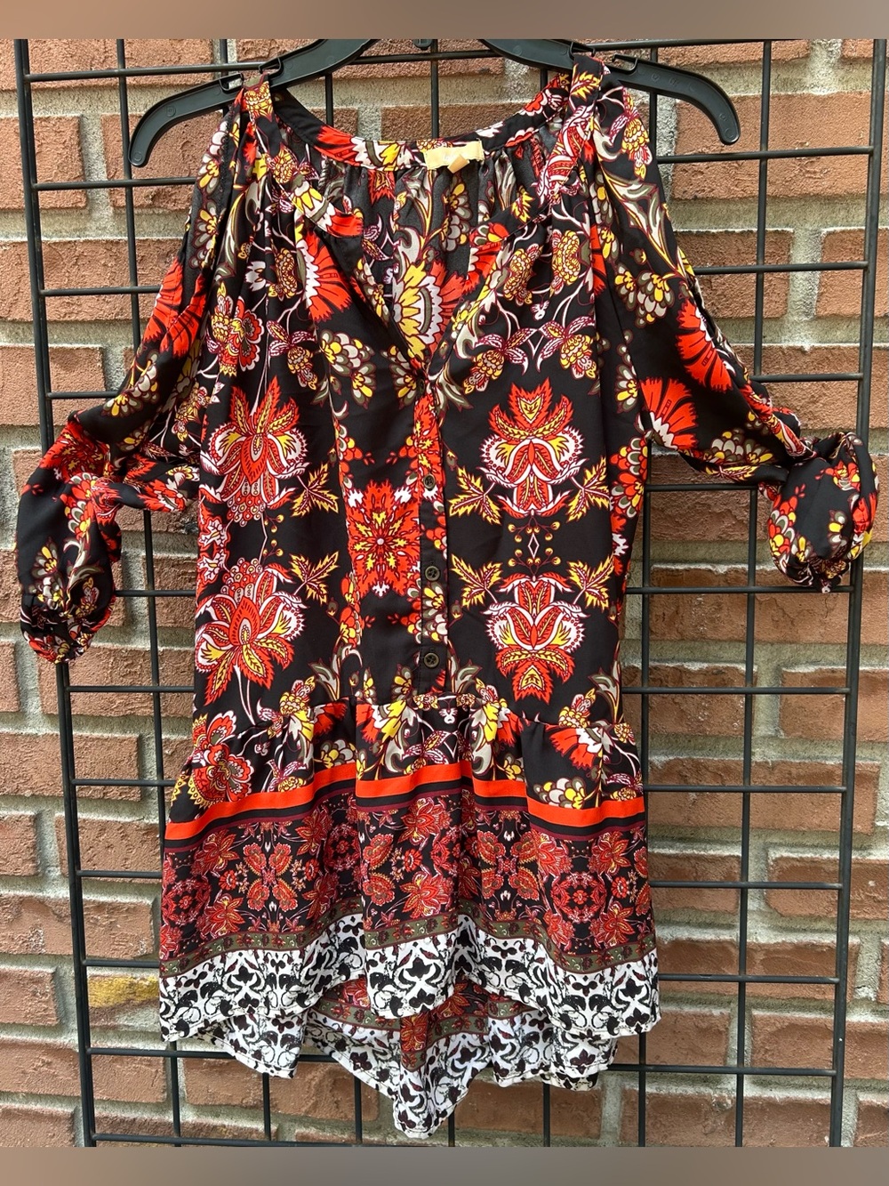 Takara Black Floral Cold-Shoulder Blouse with Red and Orange Accents
